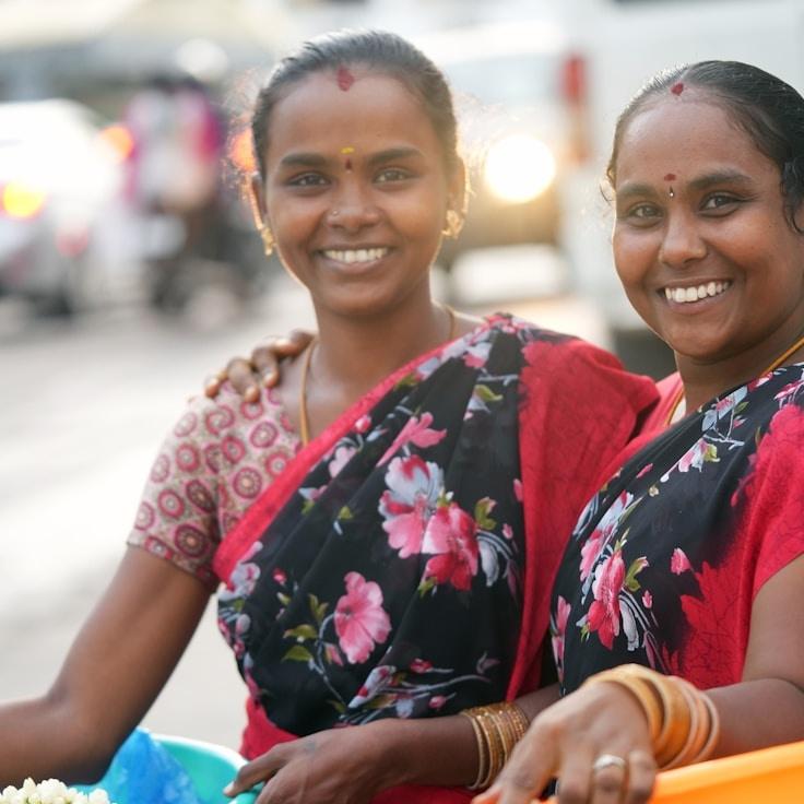 Lina Kapoor, Lead Design Curator at LatticeLightRoot, reviewing corporate floral arrangements